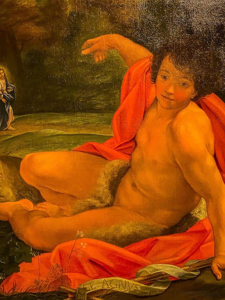 Close-up of a classical painting at the Montreal Museum of Fine Arts, showing a partially draped figure reclining with a serene expression and pointing toward a robed woman in the background. A cultural highlight often included in guides on things to do in Montreal in spring. des Beaux Arts, Montreal Museum of Art, Art collections