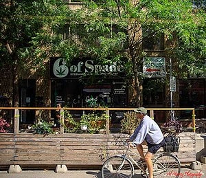 Cycling by the outdoor patios along the Toronto streets