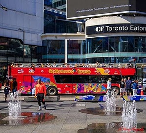 Hop-on, Hop-off Bus at its starting point in Yonge & Dundas Square in downtown Toronto. It is a great way to  kick off fun things to do in Toronto this fall