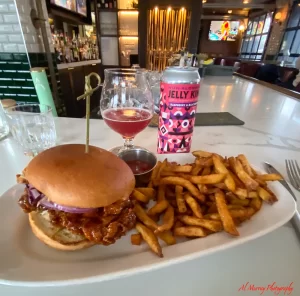 The Commoner on Roncy lunch of spicy chicken sandwich and non alcoholic beer