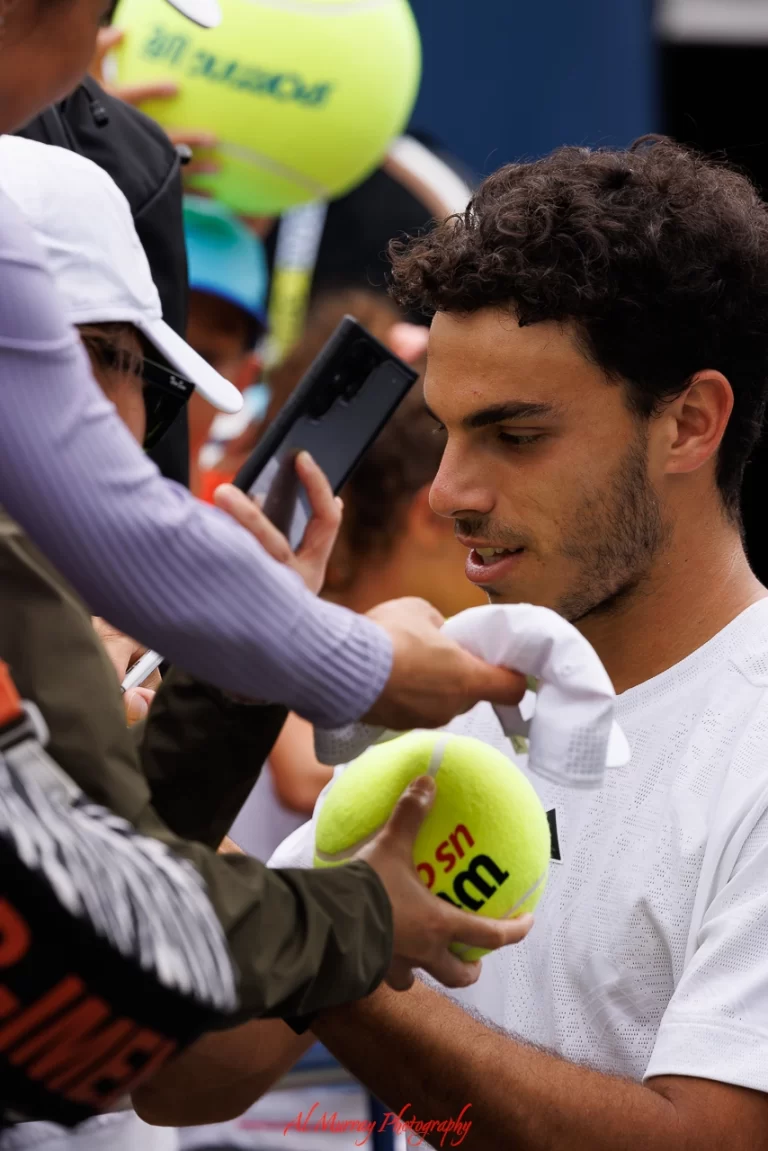 National Bank Open player Francisco Cerundolo signs autographs for fans