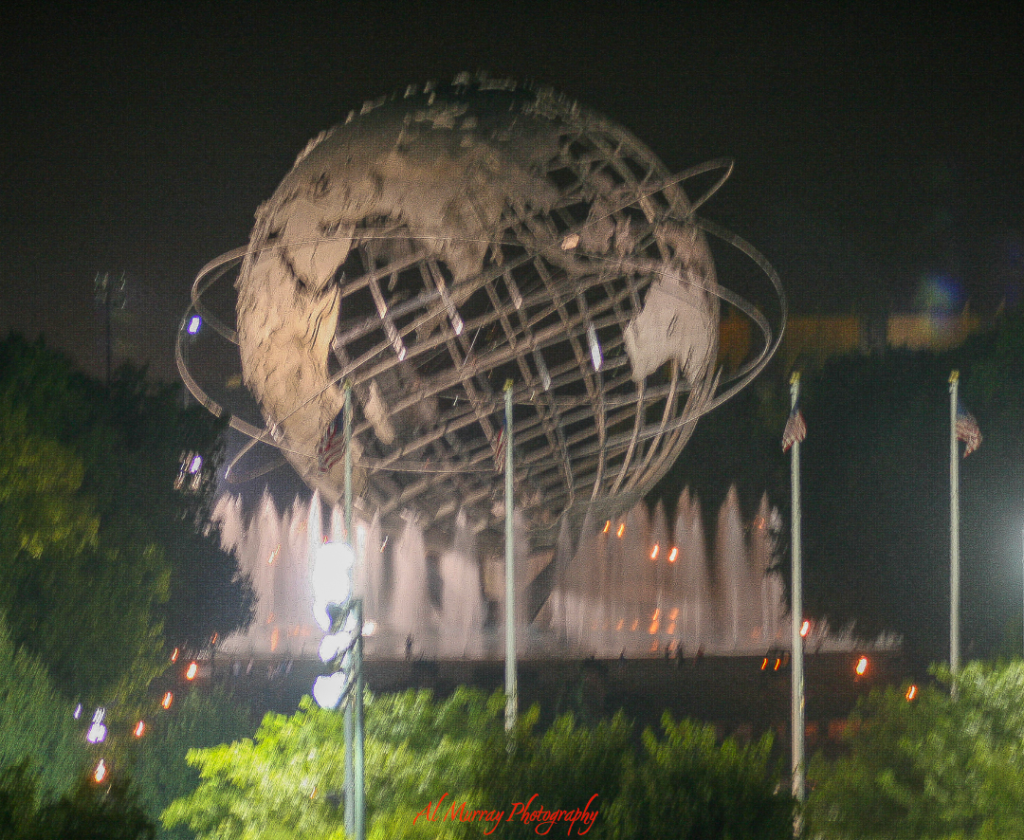 The Unisphere in Queens, New York, lit up at night with glowing fountains surrounding the iconic globe sculpture. Located near the US Open tennis grounds, it’s a scenic spot ideal for evening strolls away from daytime tournament crowds.