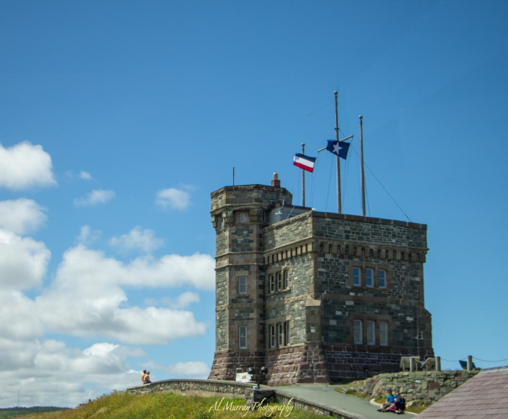 Cabot Tower, a historic stone structure perched on Signal Hill, stands under a moody sky overlooking St. John's. A highlight of Avalon Peninsula scenic drives, this landmark offers sweeping coastal views and a glimpse into Newfoundland's maritime history.
